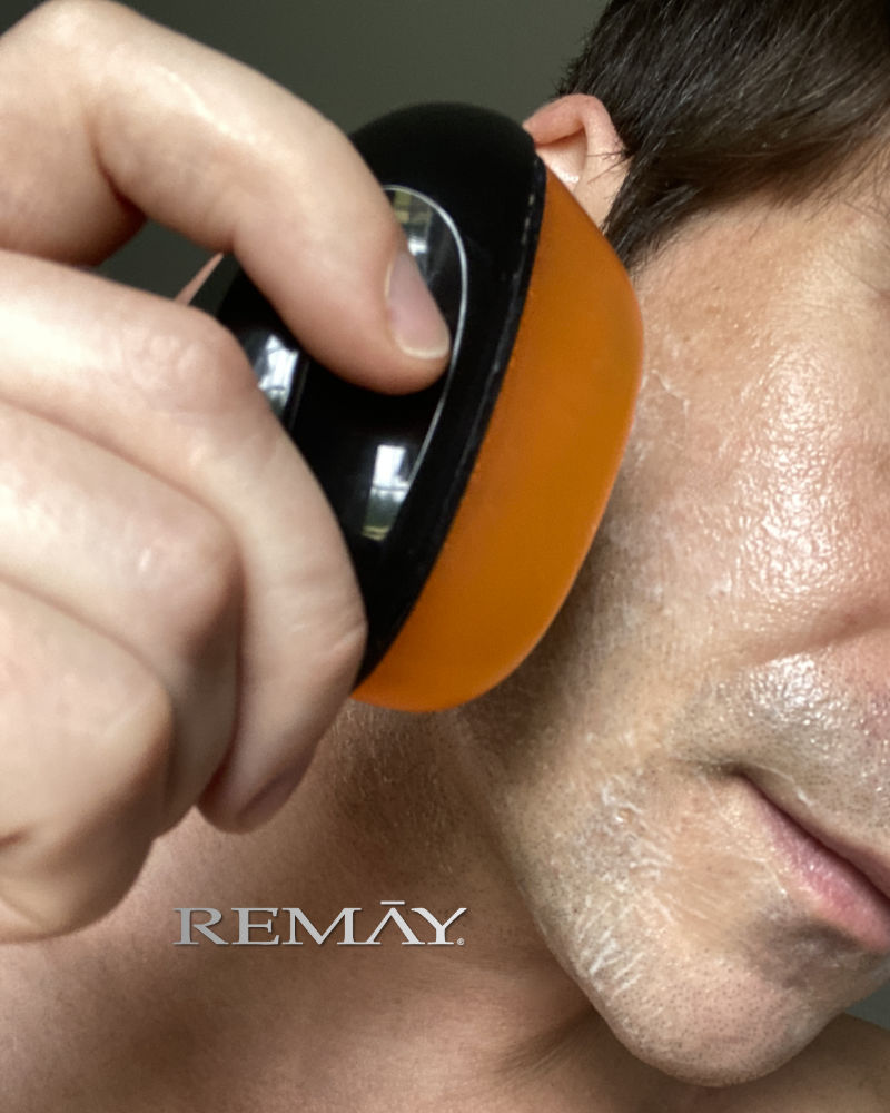 Clear shaving gel being applied to a mans face