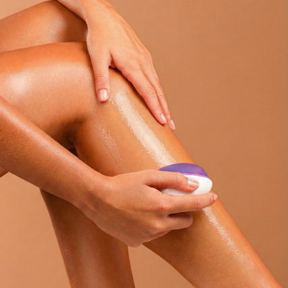 Woman using REMAY shaving cream bar on her leg against showing a glossy translucent micro-barrier on a beige background