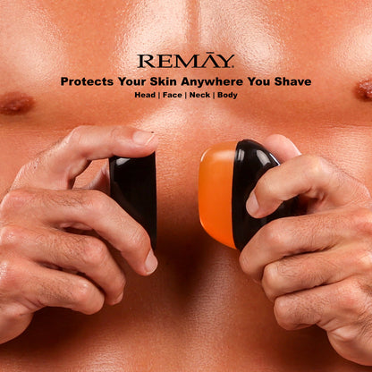 Two hands holding a black and orange REMAY Heat shaving cream for men gel bar near abdomen, with REMAY branding above and text that reads "Protects your skin anywhere you shave".
