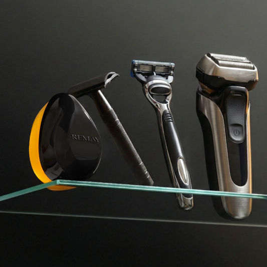 REMAY Heat shaving cream for men gel bar product next to a safety razor, a cartridge razor and an electric shaver on a glass shelf against a black background.